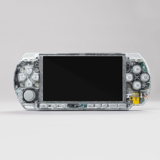 Front view of a Sony PSP console with a fully transparent clear shell and grey control buttons, showing internal components and clean mod finish