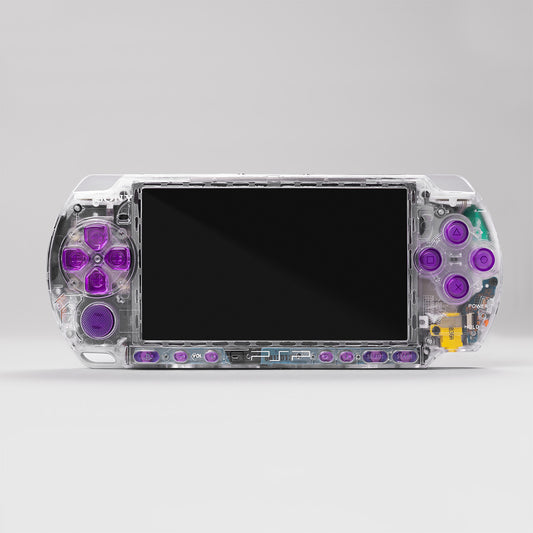 Transparent clear-shell PSP-3000 with purple buttons running custom firmware 6.61 PRO-C. Handmade by PlayingScorp — showcasing internal components through crystal housing.