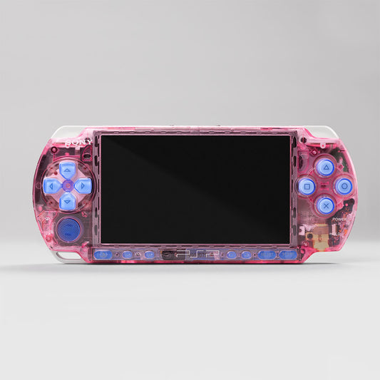 pink-transparent-psp-3000-handheld-blue-buttons-in-hand