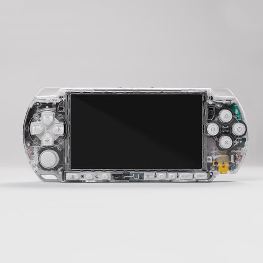 Front view of a Sony PSP handheld console with a custom transparent clear shell and white control buttons
