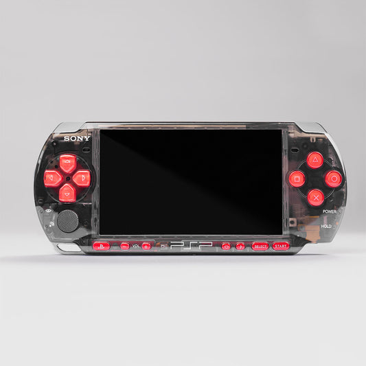 Front view of a custom Sony PSP with a transparent smoke black shell and bright red buttons, showcasing a modded handheld gaming console